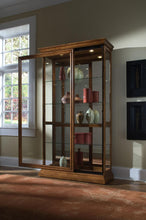 Load image into Gallery viewer, Pulaski Golden Oak Two Way Sliding Door Curio
